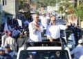 Aspirantes municipales del PRM caminan bajo el manto de Abinader