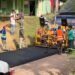 Tras más de 45 años de espera, inician asfaltado de carretera en El Chacaro, Monte Plata
